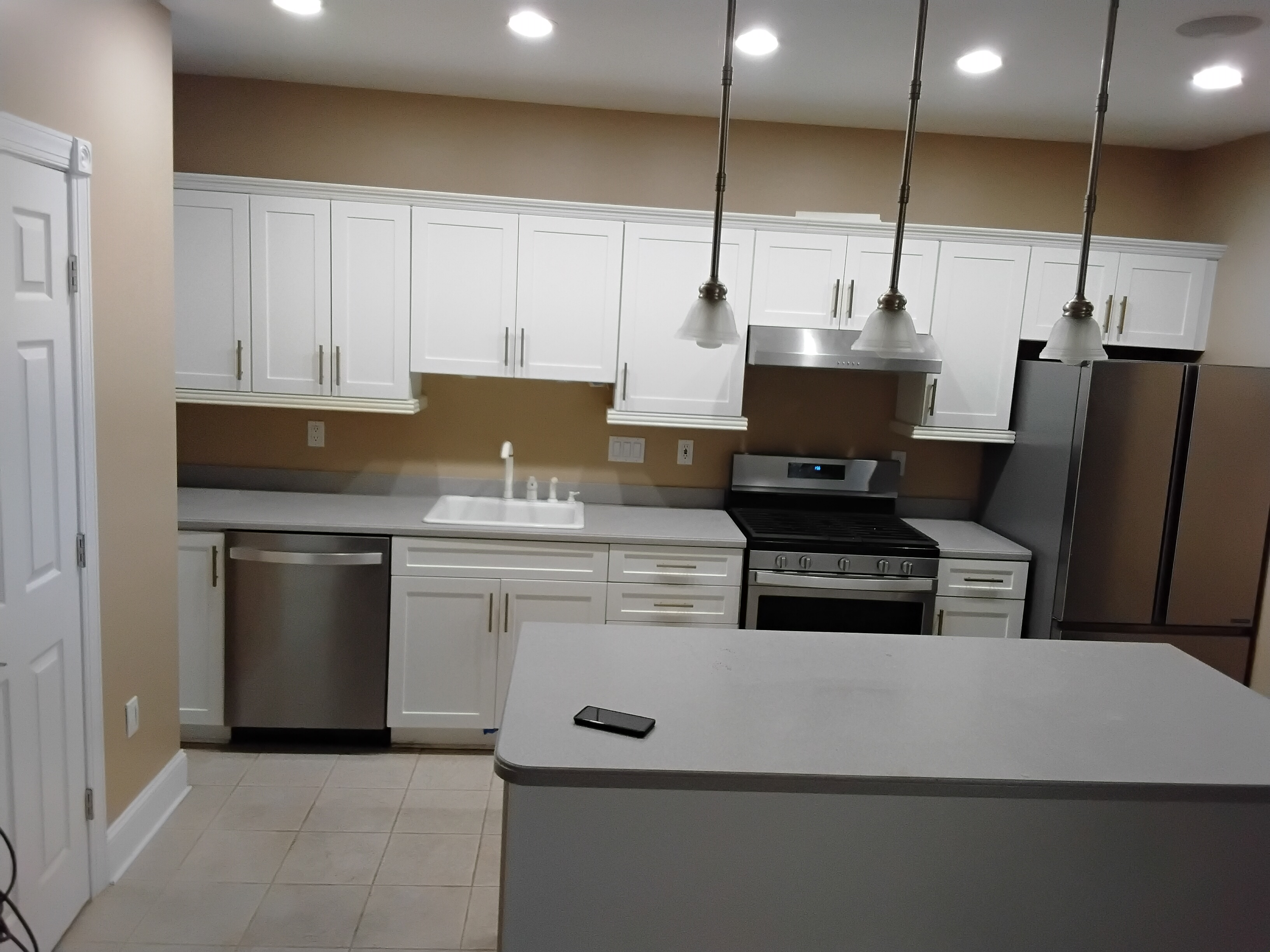 White custom kitchen cabinetry installation